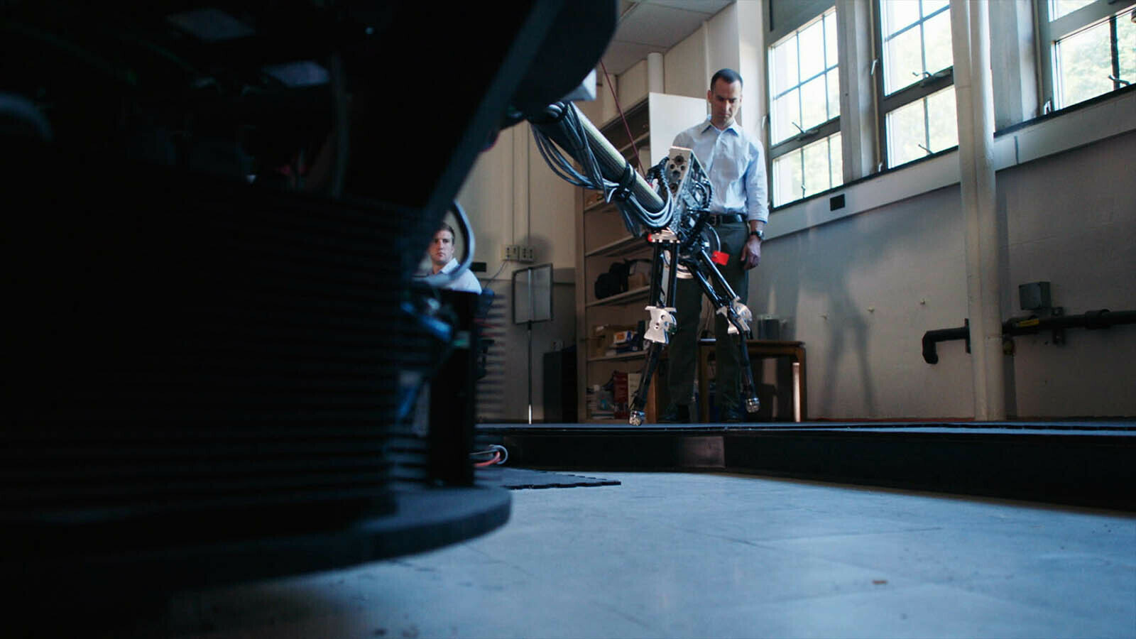 James Schmiedeler with his walking robot.