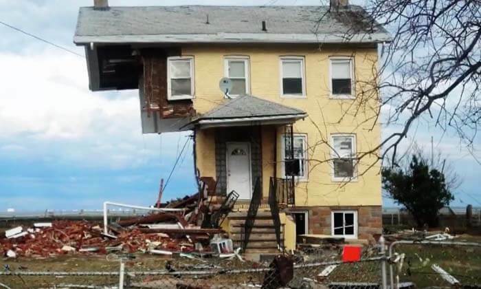 A house, with half of it blown off.