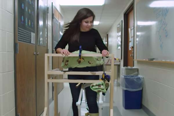Marissa walks with her prototype walker.
