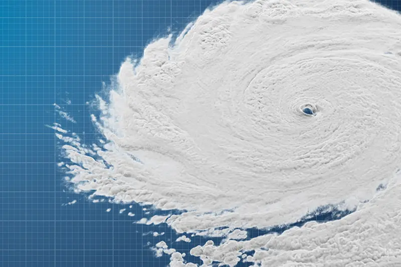 Satellite image of a hurricane with a clearly defined eye over a blue gridded map.